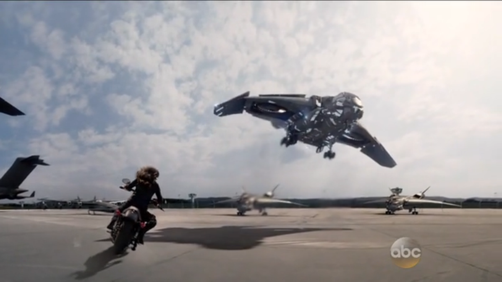 Quinjet activating cloak. Why didn't she catch a ride? Where did the motorcycle come from? No idea.